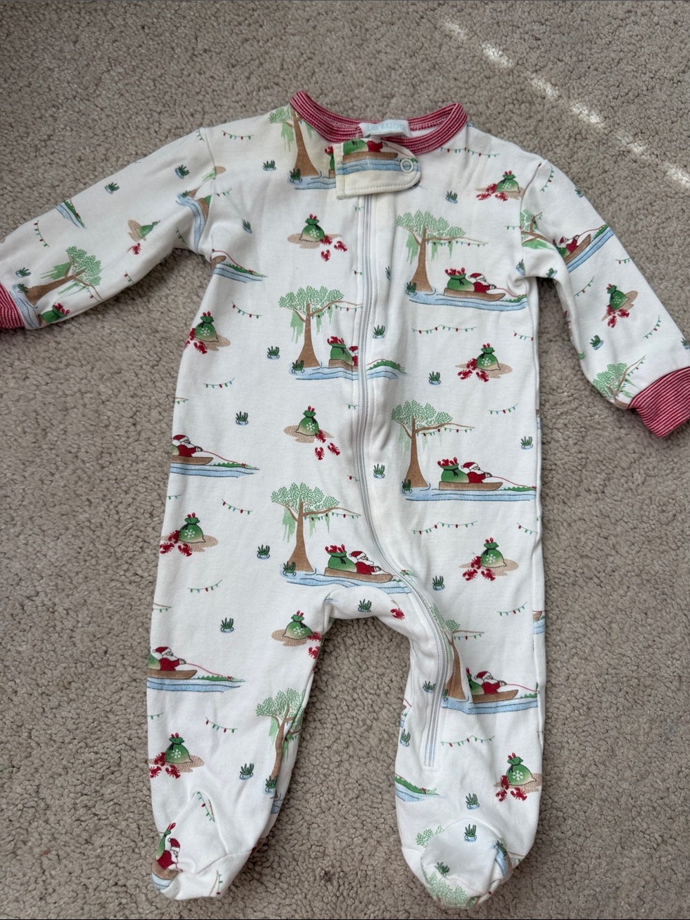 La Luna White Footed One-Piece Pajama with Green & Red Santa on a “Cajun sleigh”